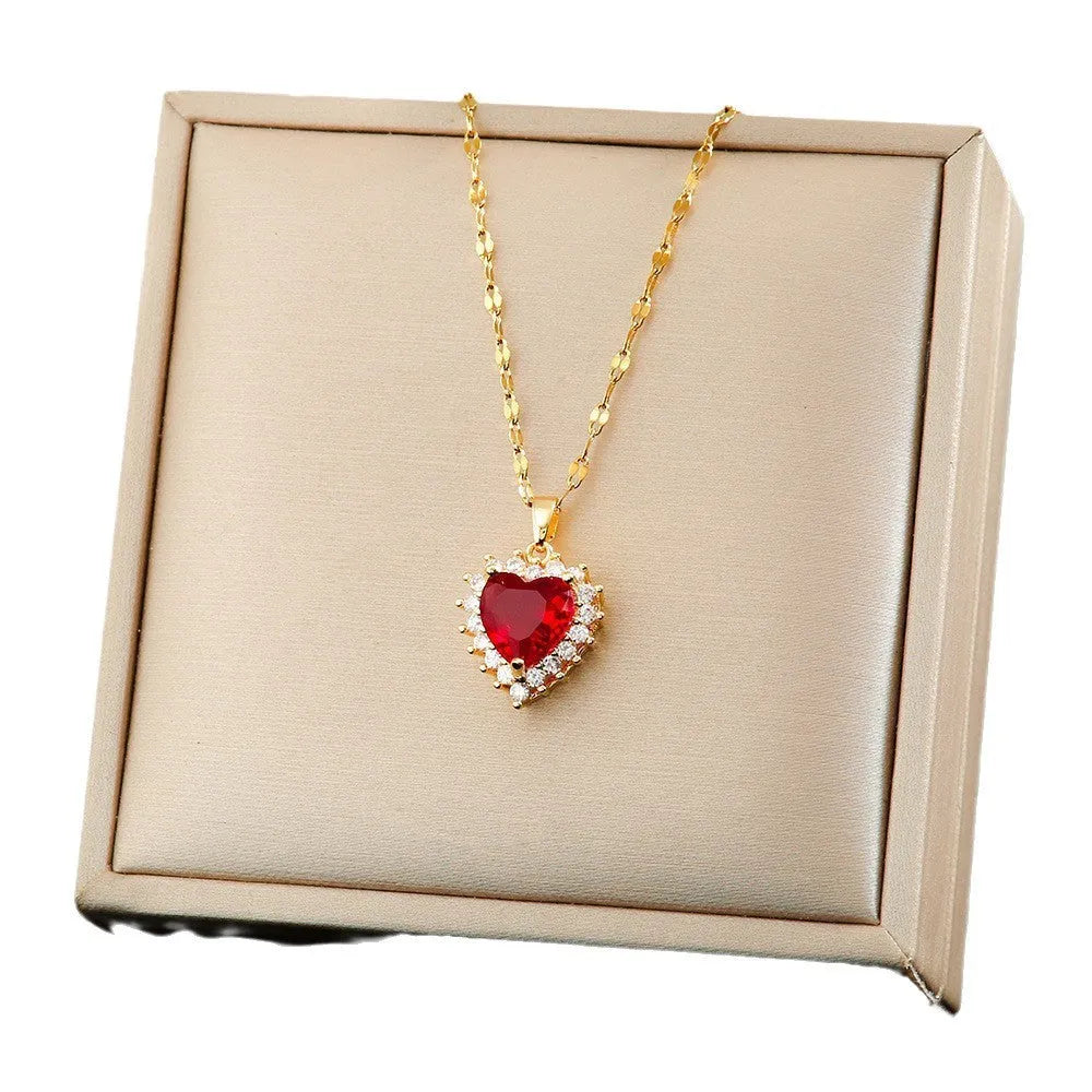 Gold red titanium steel necklace, earrings, and ring set with heart flower pendant.