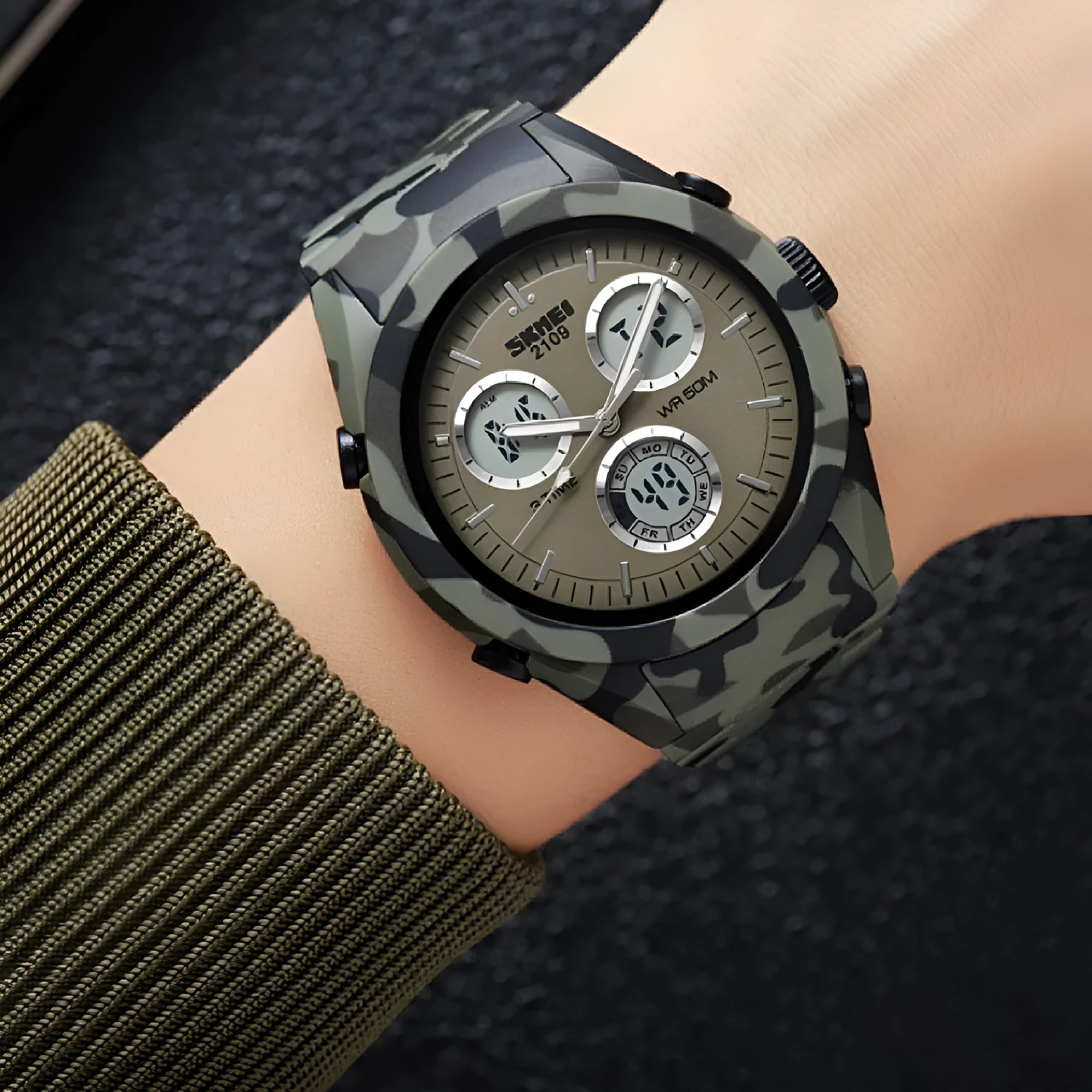 Casual digital watch with a camouflage strap and a digital display, showing 50m waterproof rating.