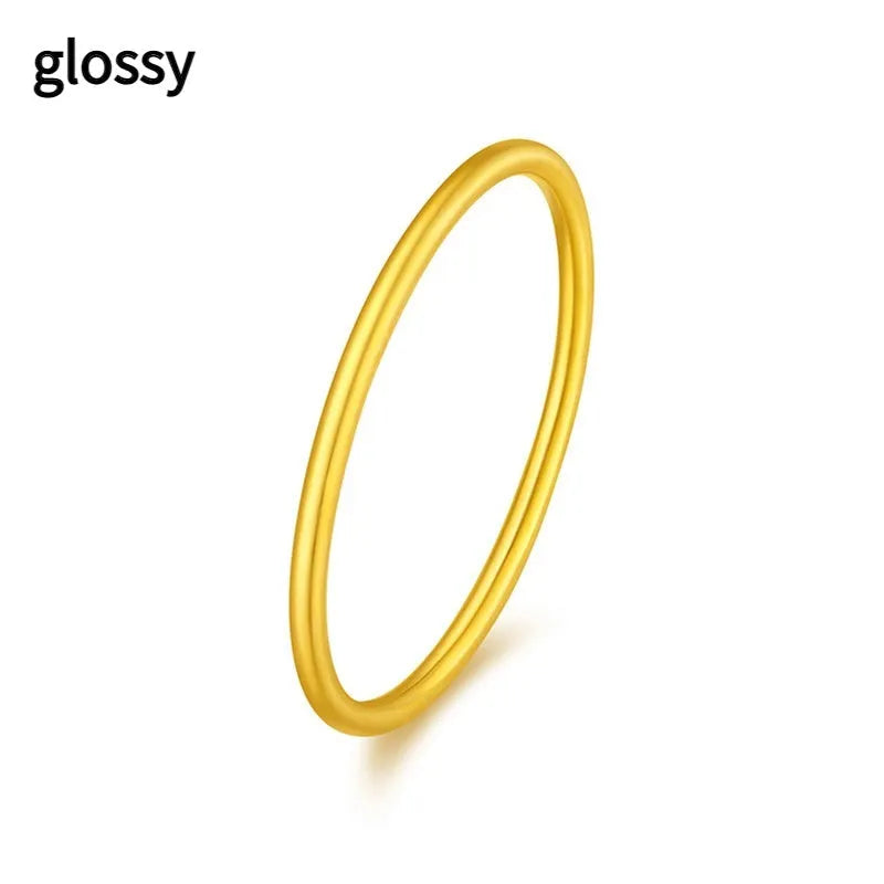 Women's simple bracelet style brass gold plated ring shown in twist, matte and glossy finish variations.