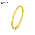 Women's simple bracelet style brass gold plated ring shown in twist, matte and glossy finish variations.