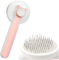 Self-cleaning pet brush with rubber handle and massage needles for cats and dogs
