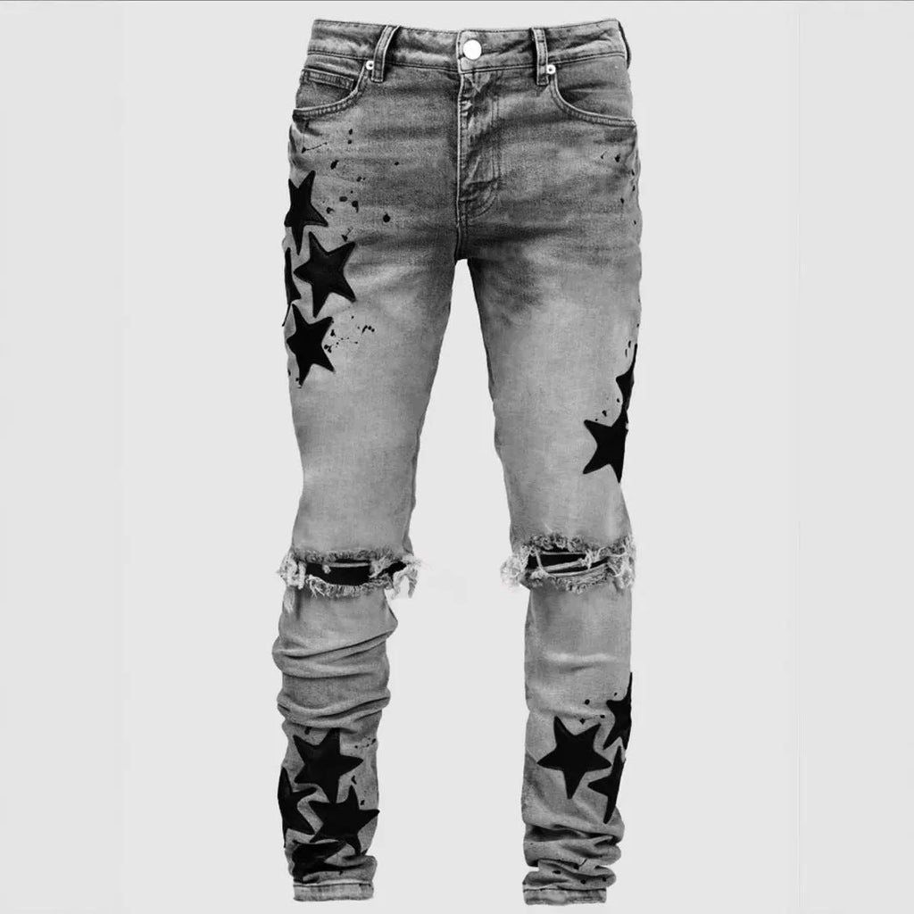 Men's slim fit stretch jeans in blue with mid waist and subtle embroidery detail on denim.