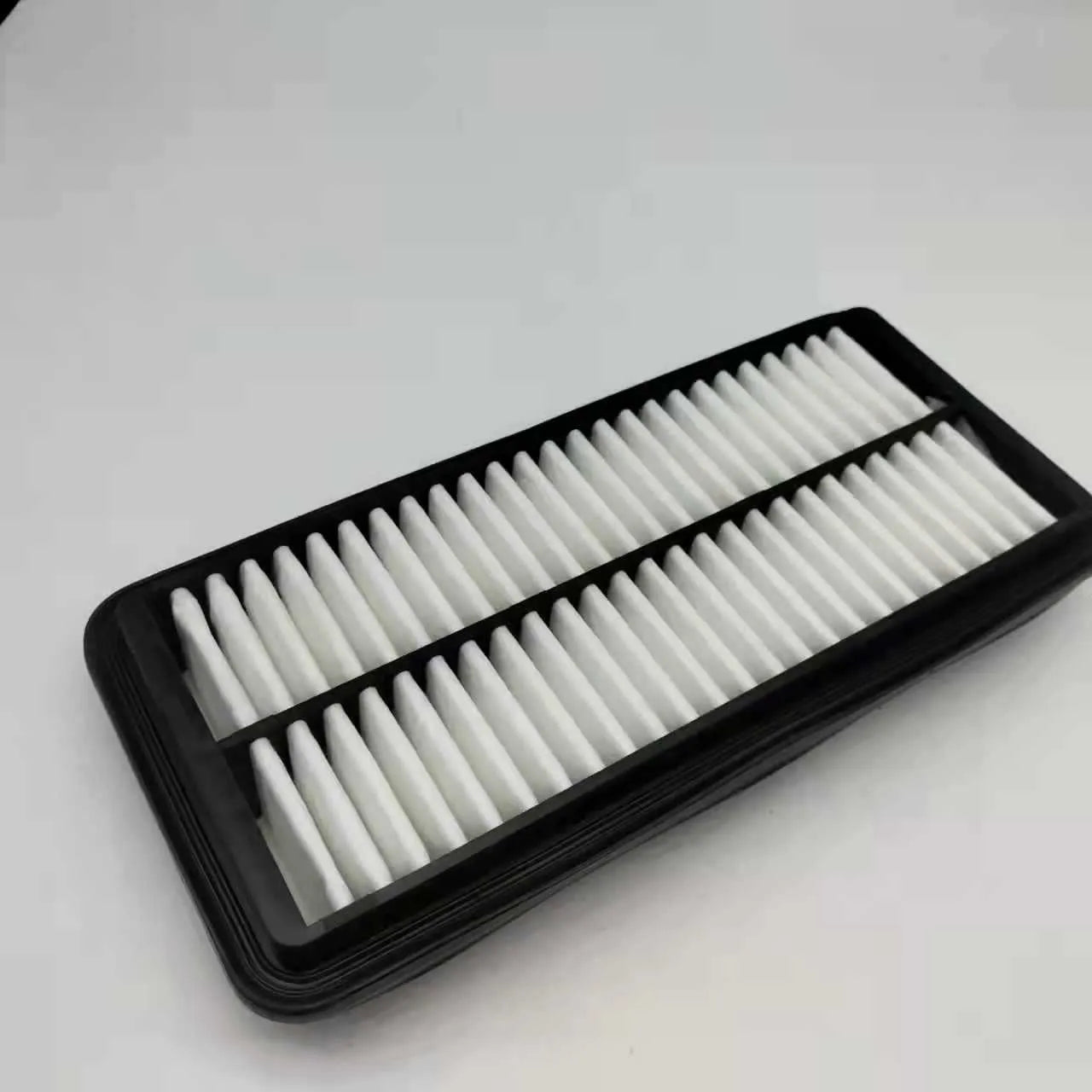 Black panel car air filter with dimensions 256mm by 113mm by 40mm for Modern vehicles.