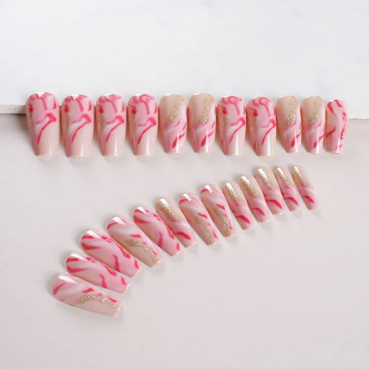 Set of medium-length false nails showing rose, tulip, leopard print, and XINGX patterns with glue.