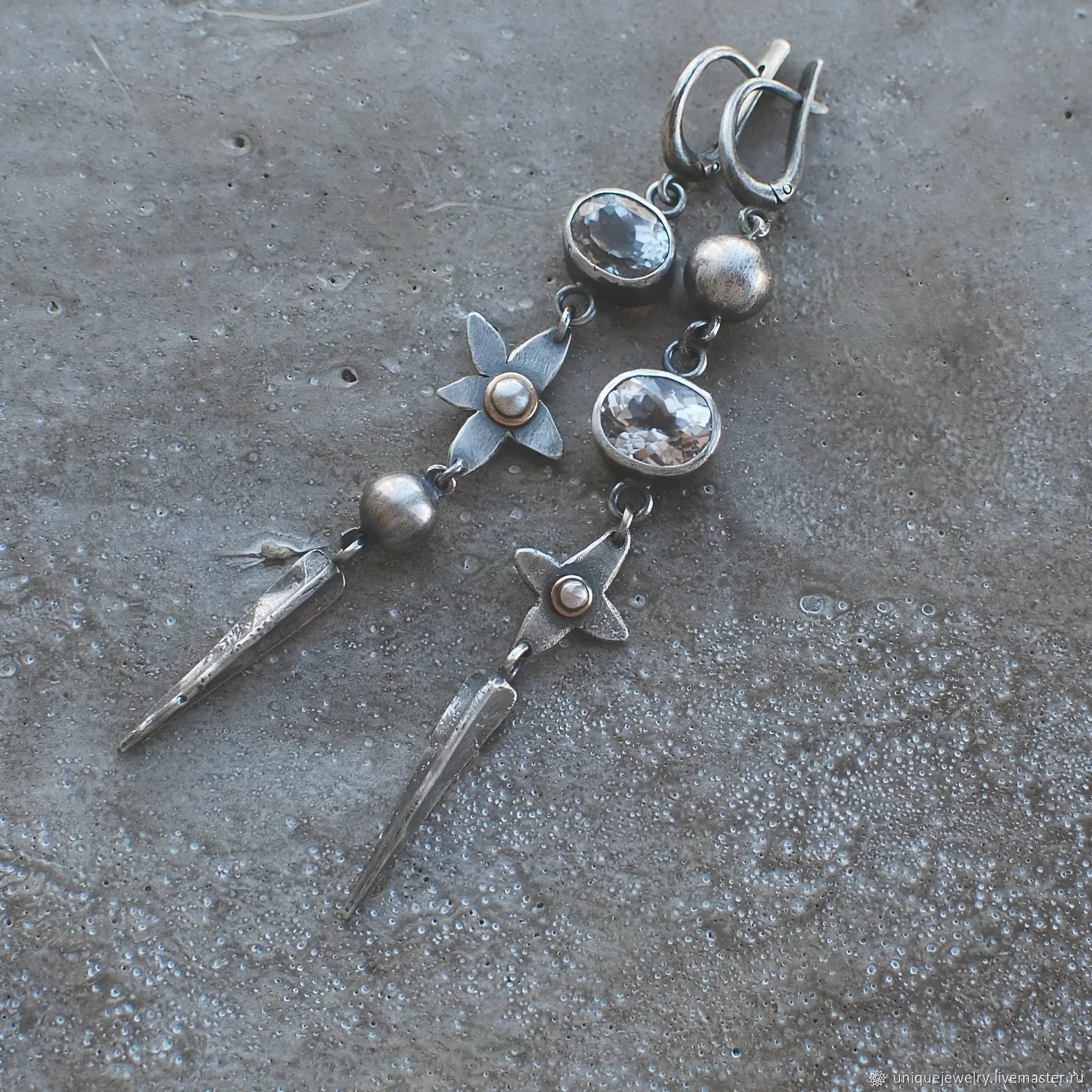 Geometric long XINGX pendant earrings in antique silver with rhinestone details on alloy.