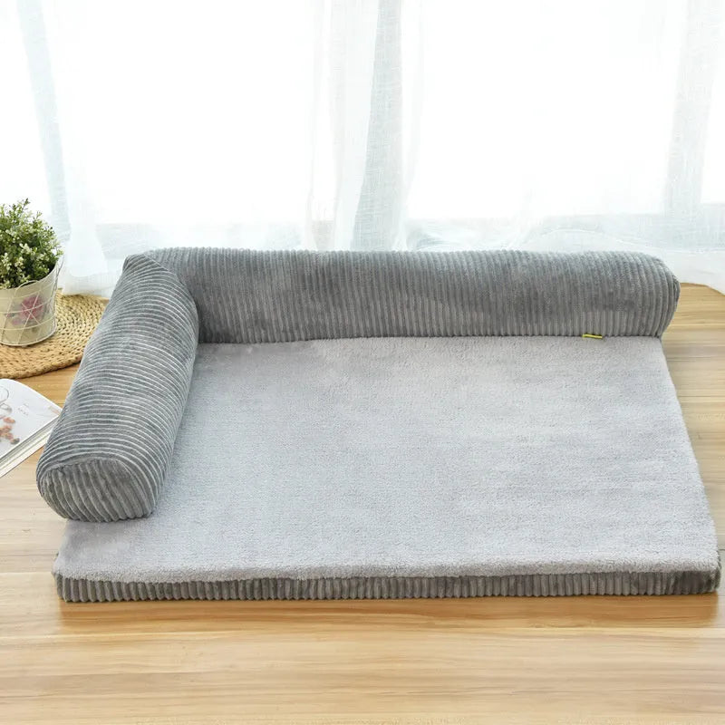 Corduroy bolster dog bed in grey with a removable cover, shown in a large (L) size on a hardwood floor.