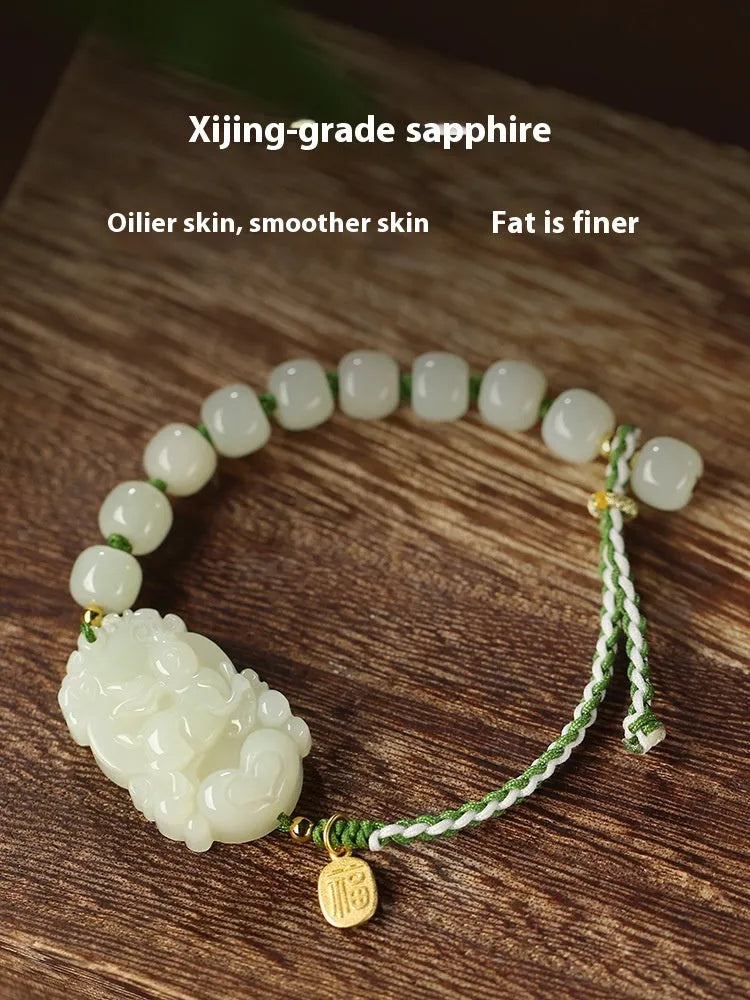 Hetian Jade Chinese zodiac bracelet on red cotton rope with S925 silver card for Year of Rabbit.