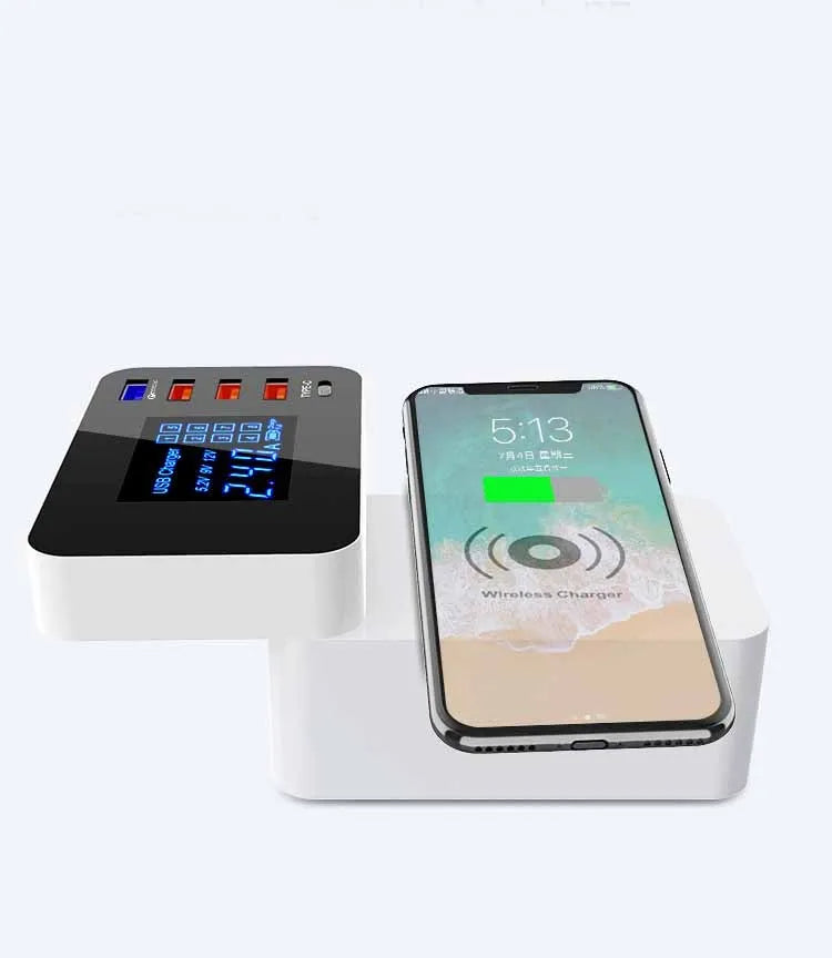 White multi-port USB fast charger with travel plug adapters and a long cable on a desk.