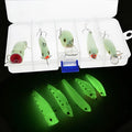 Set of five fluorescent green and orange hard plastic fishing lures with 3D details on a blue background.