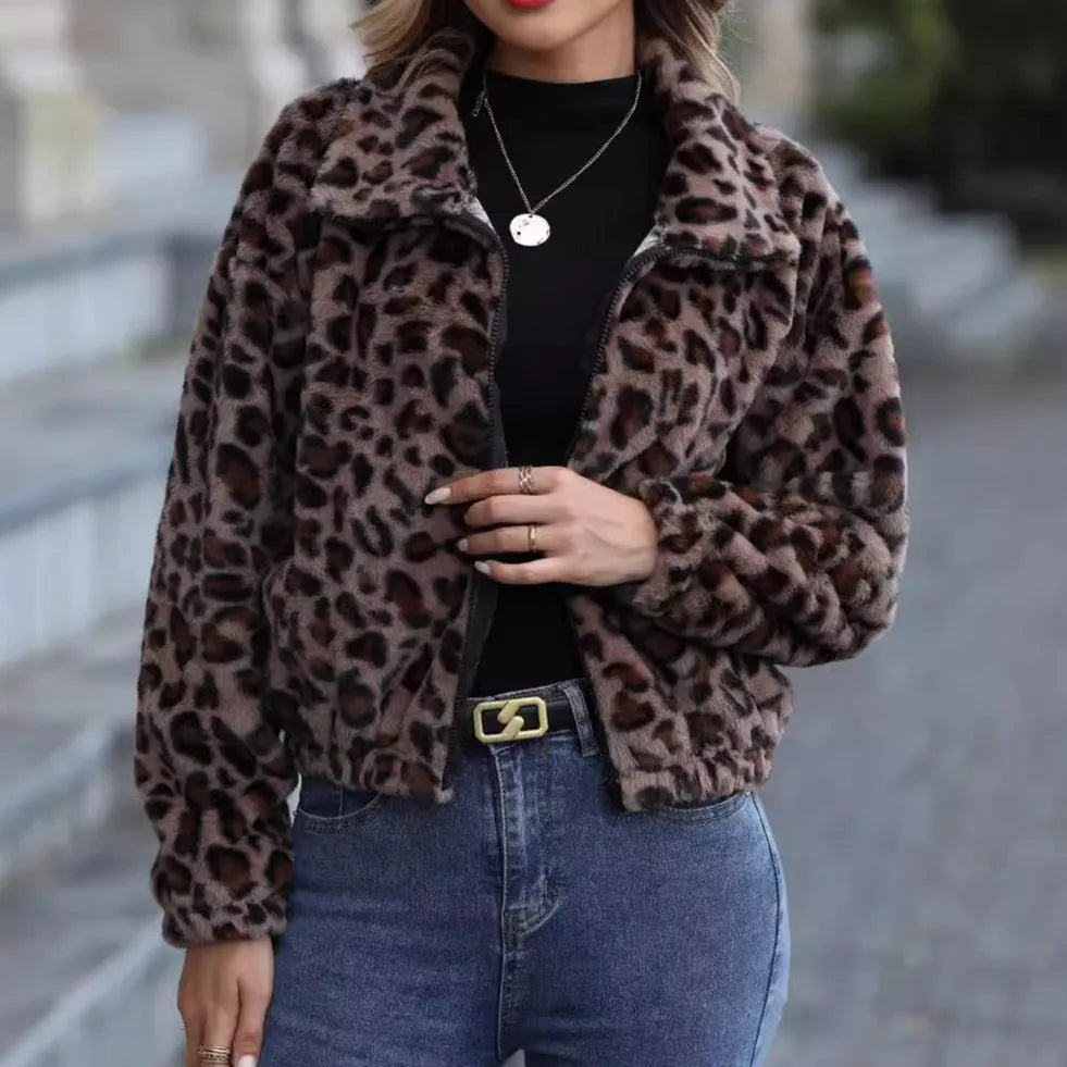 Women's loose fit leopard print plush coat with zip front and raglan sleeves.