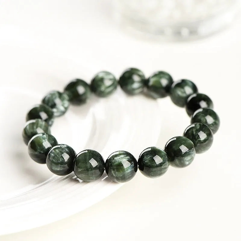 Green Dragon Crystal bracelet with 8-9mm round beads and a Ruyi element.