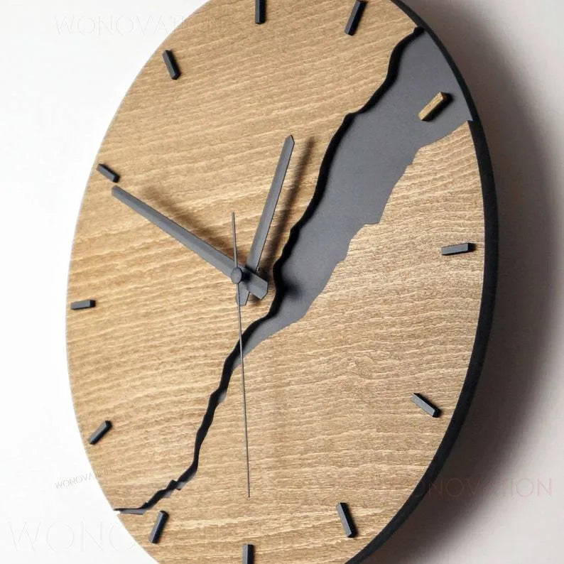 Modern wooden wall clock with a white crack design on a coloured background.