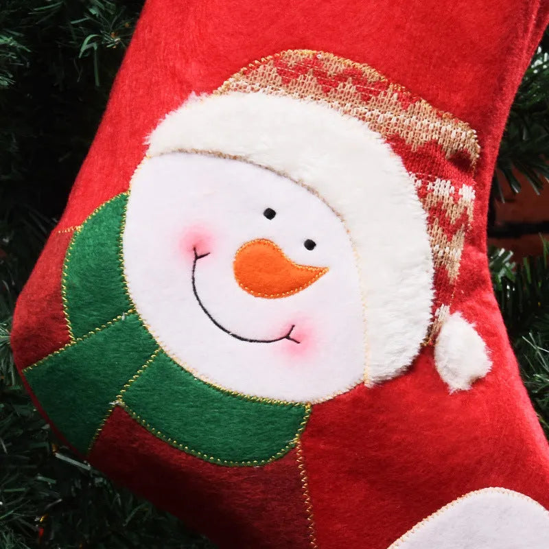 American style non-woven fabric Christmas stocking bag in elk, old man, or snowman design.