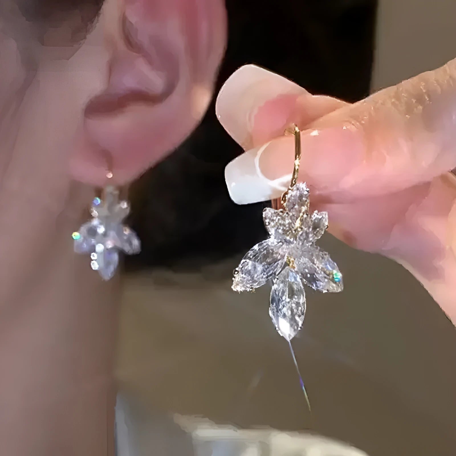 Platinum colour alloy earrings with leaves shape design featuring inlaid zircon stones