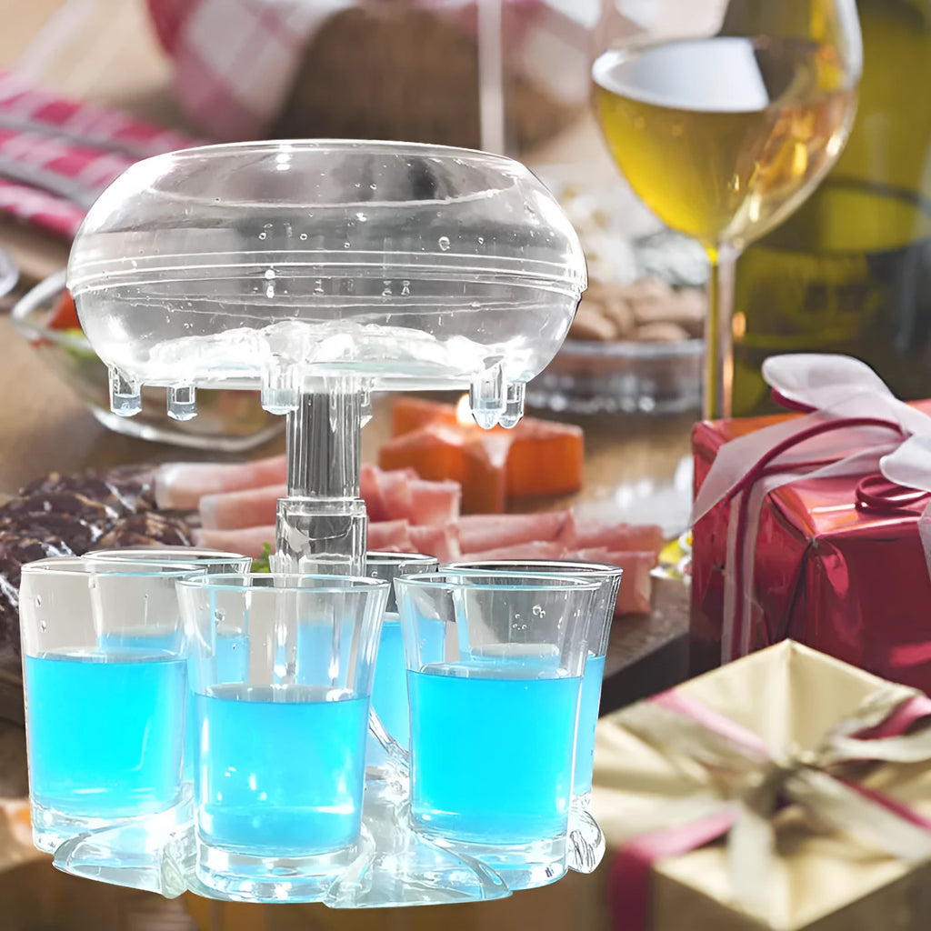 Transparent six-cup shot glass dispenser rack with gold-trimmed cups on a table.