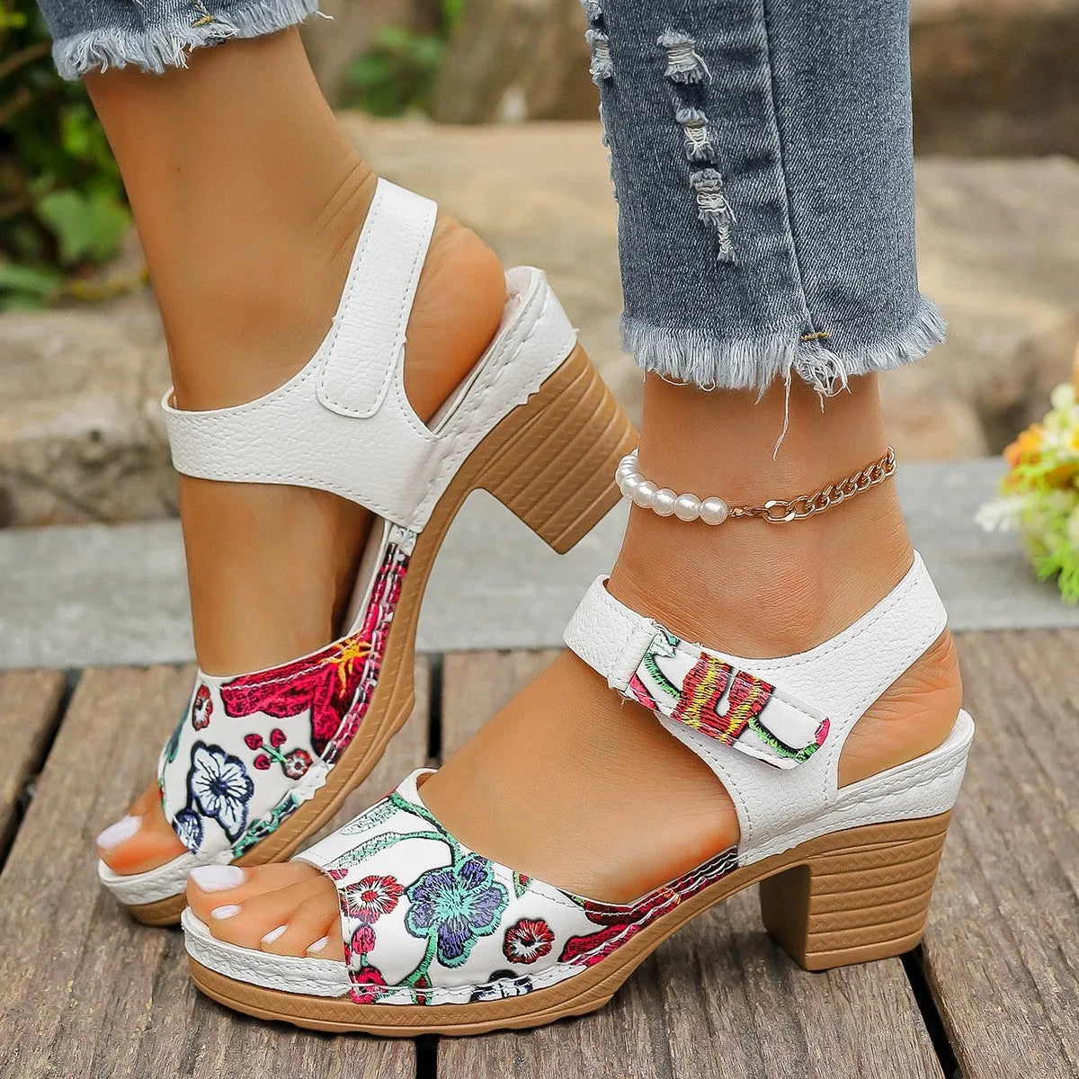 White women's high heel sandals with velcro buckle closure showing rubber sole