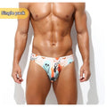 Man wearing quick-drying digital print polyester shorts in a low waisted briefs style.