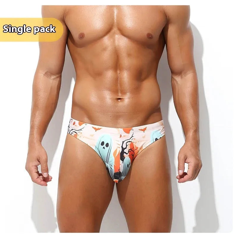 Man wearing quick-drying digital print polyester shorts in a low waisted briefs style.