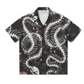 Short sleeve loose fit Cuban collar shirt with snake bone and floral printed pattern.