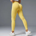 Women's mid waist yoga pants in solid colour with hip-tight fit for running and fitness