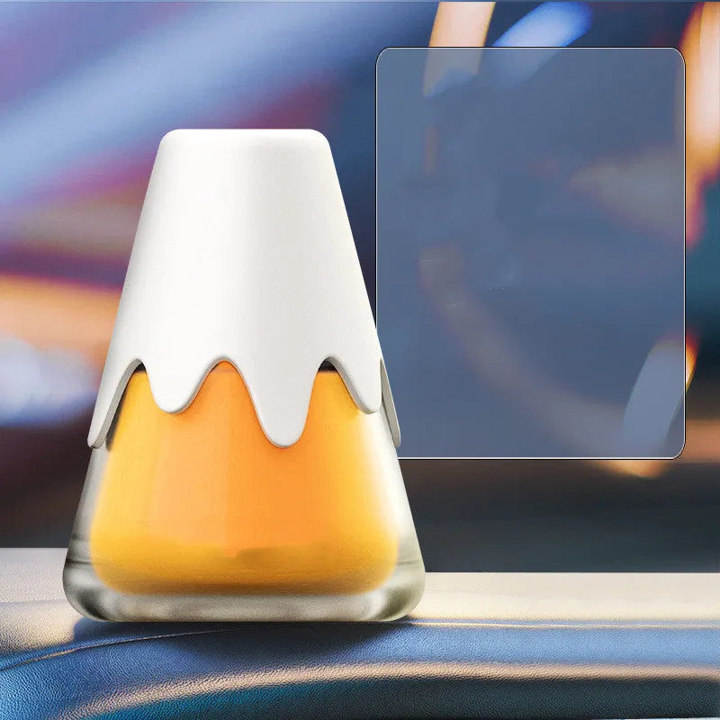 Glass car aromatherapy diffuser with fragrance cream measuring 9.1 by 6.9 cm