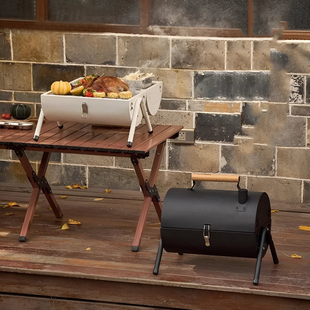 White round portable chimney grill with carbon tanks and mesh for outdoor frying and baking.