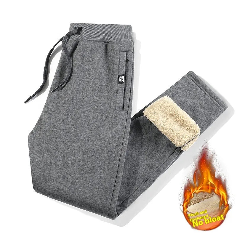 Men's black fleece-lined oversized track pants with drawstring ankles
