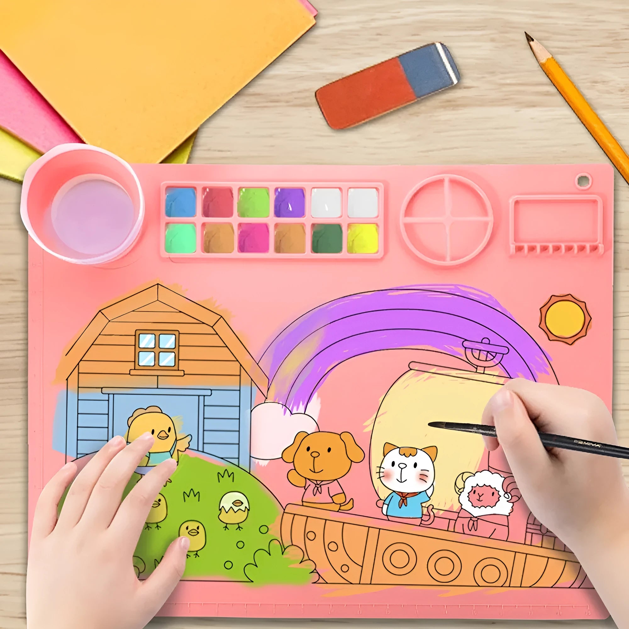 Light blue silicone painting mat measuring 50 by 40 centimetres with two round paint wells.