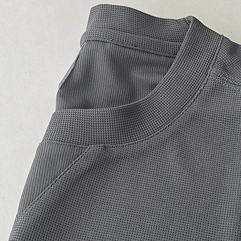 Men's heavyweight waffle-knit short-sleeve t-shirt in a solid colour, shown on a hanger.