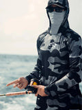 Huk Pursuit long sleeve performance fishing shirt with mesh side panels shown on a model.