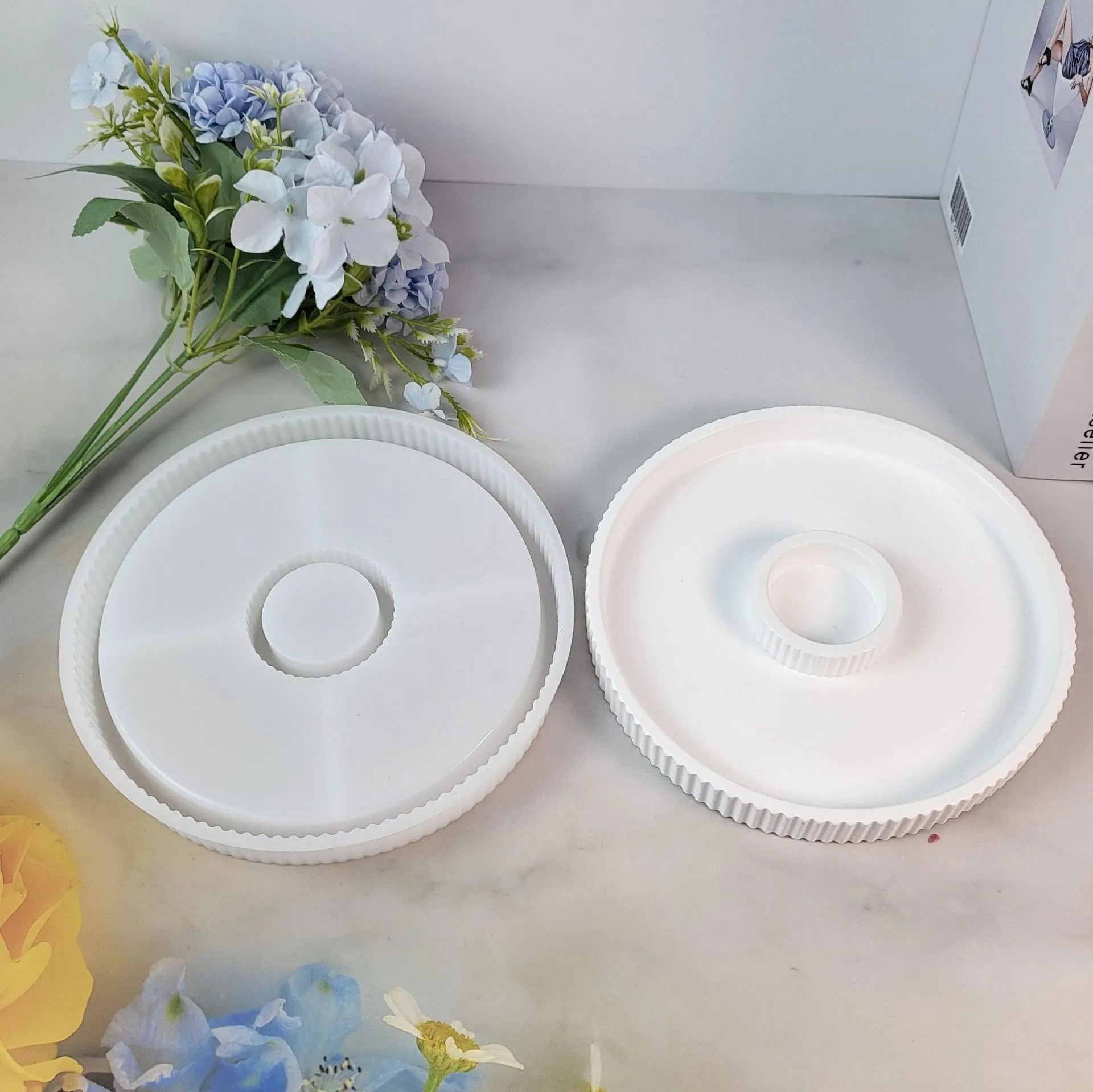Set of five silicone baking moulds including tray, candlestick, and base shapes