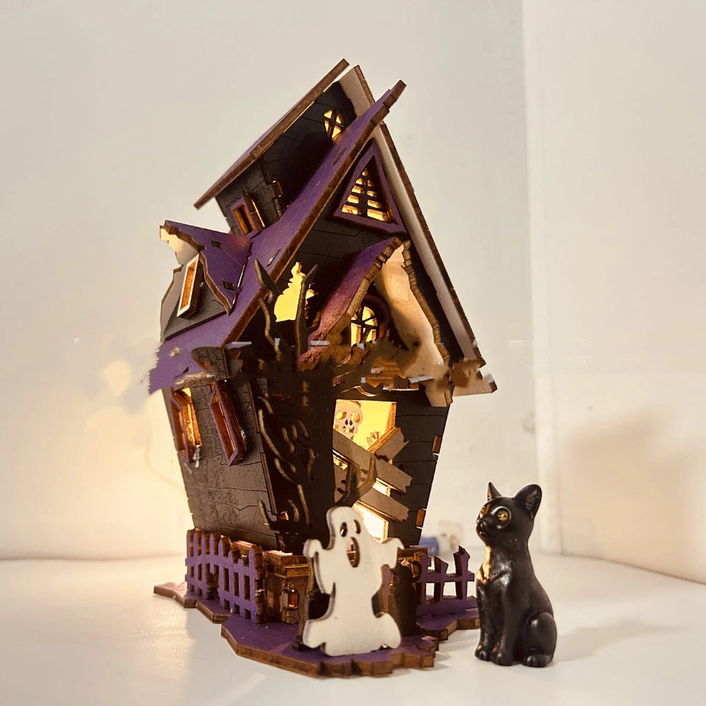 Unpainted DIY wooden haunted house Halloween decoration for use as a candlestick, shown next to a ruler for scale.