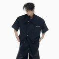 Men's loose fit short-sleeved summer shirt in black colour with lapel collar and decorative details