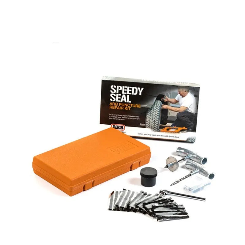 Emergency car tyre repair tool set with tools and pressure gauge in an orange suitcase case.