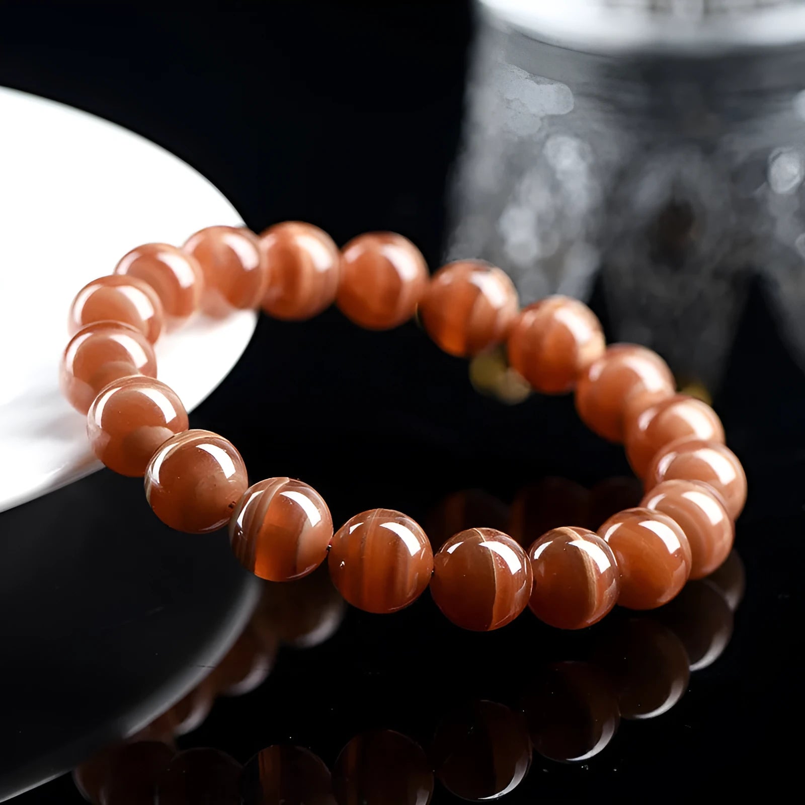 Natural old mine rhodochrosite round beads bracelet from Peru showing 6mm or 8mm geometry beads with Ruyi elements