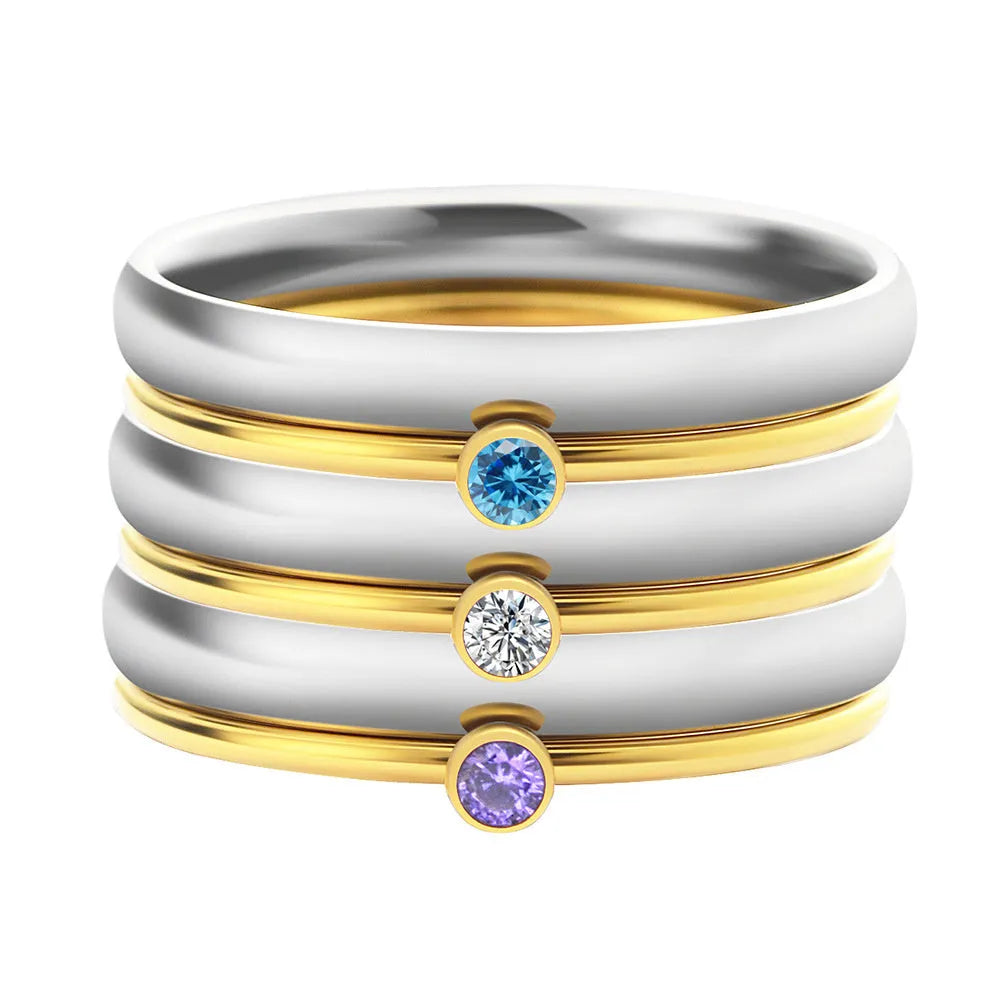 Geometric engraved titanium steel ring with December birthstone colour and electroplated gold handle.