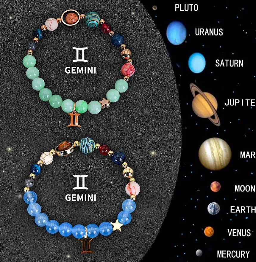 Set of two natural stone beaded zodiac bracelets with adjustable cords on a flat surface.
