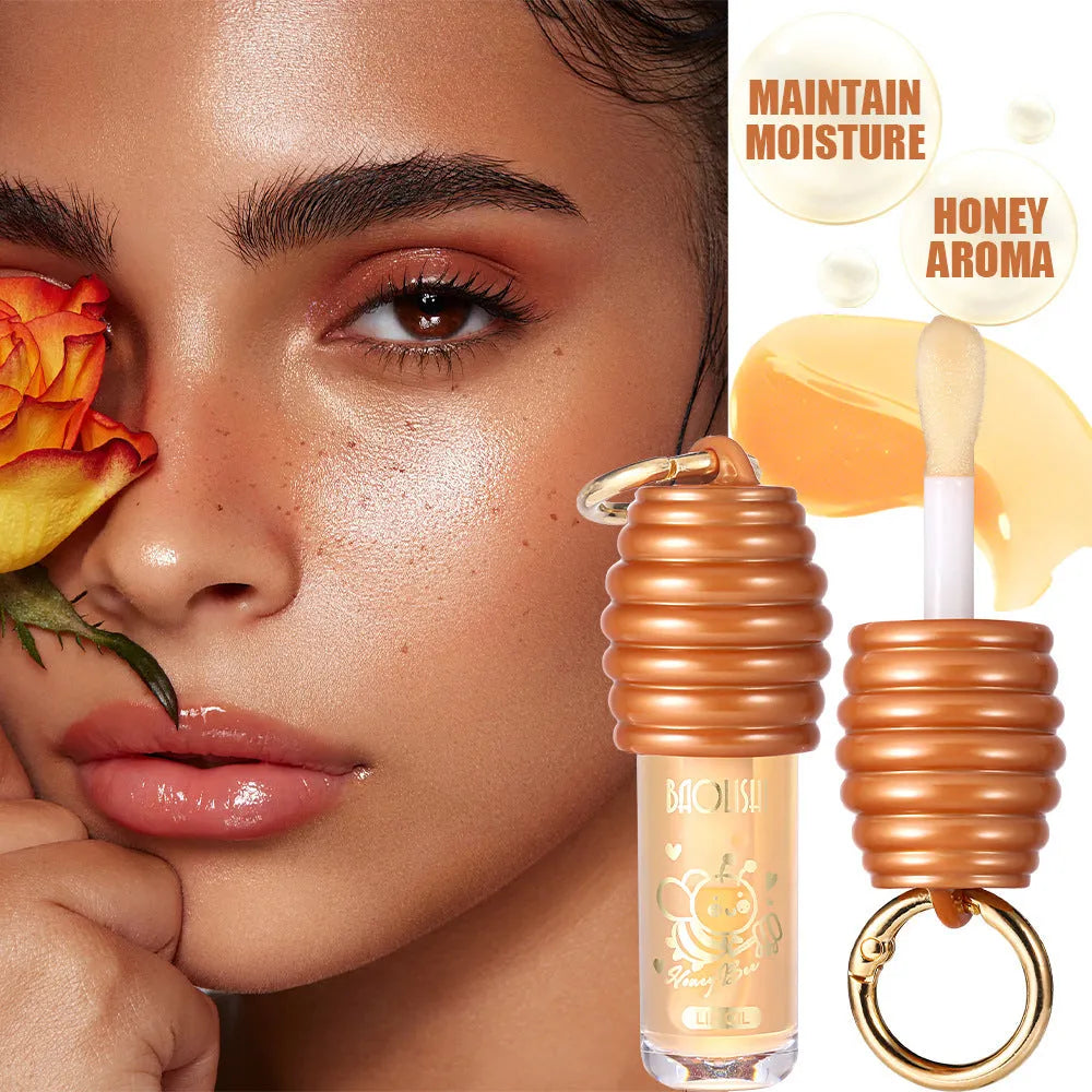 Honey lip gloss keychain with portable pannier bag carrier showing moisturising lip product