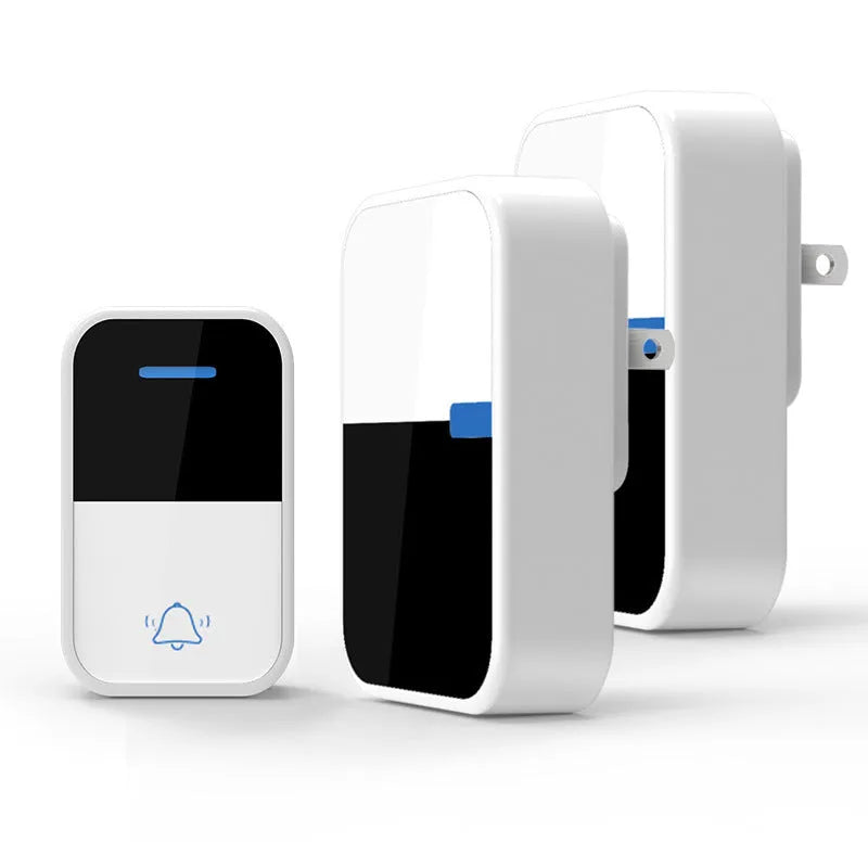 Modern white wireless doorbell receiver and self-generating transmitter on a table.