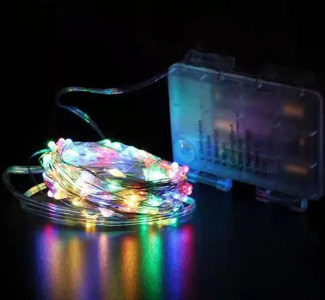 12-metre long copper wire LED string lights with 120 bulbs and a USB plug, displayed with a light post.