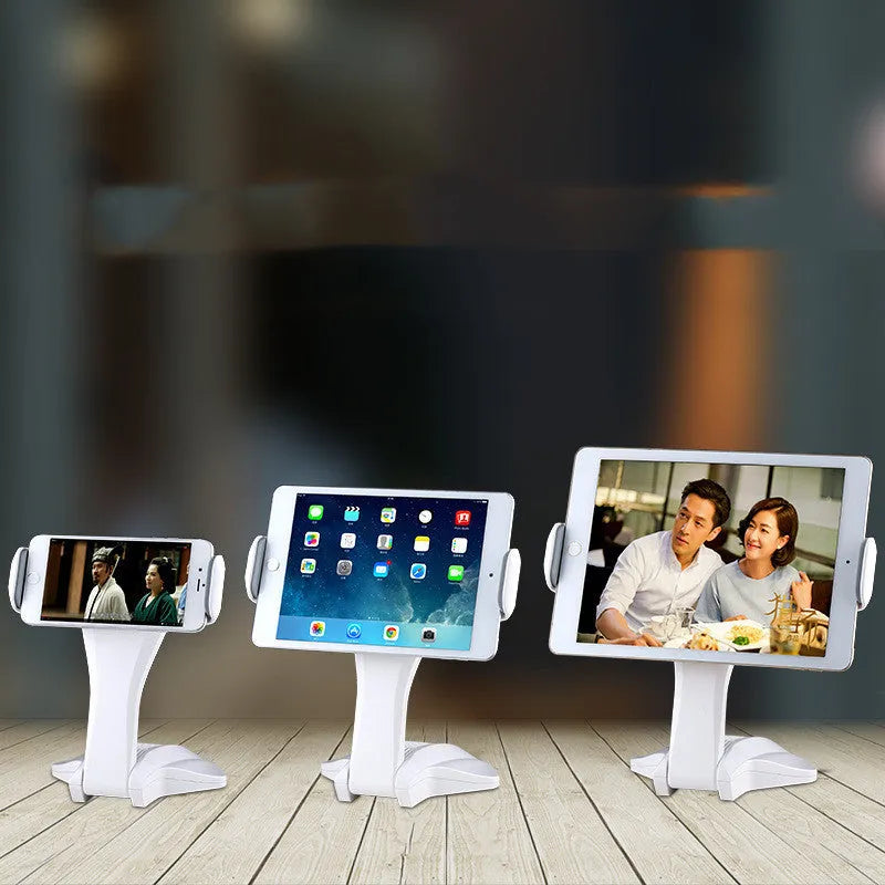 White aluminium tablet stand with adjustable clamp holding a tablet