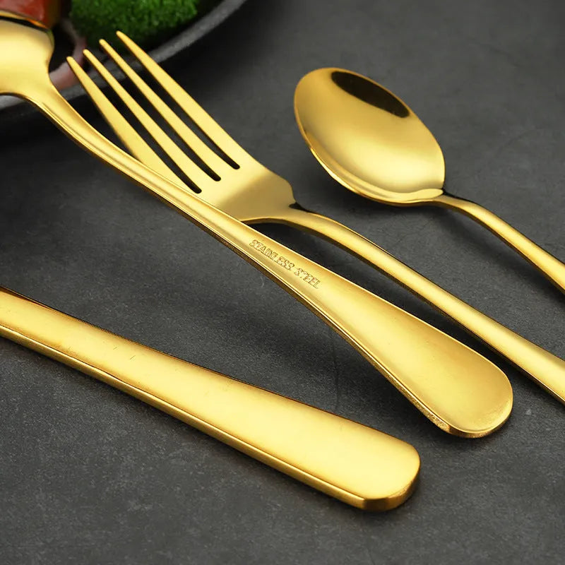 24 piece stainless steel tableware set showing knives, forks, and spoons in multiple colour finishes