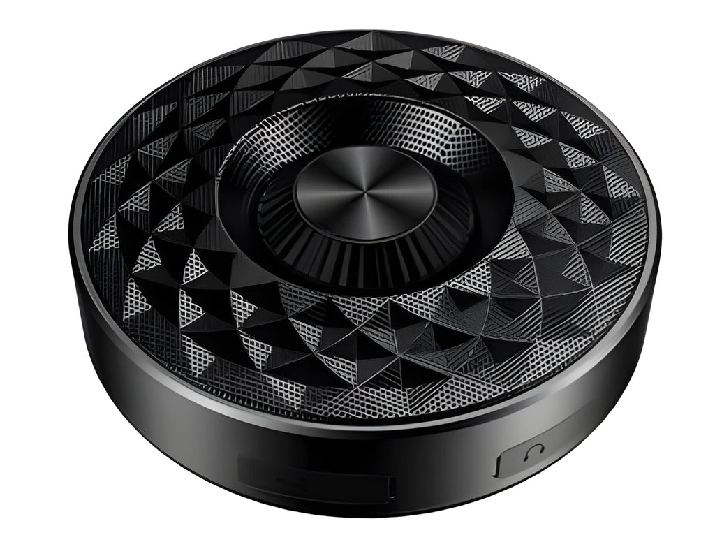 Compact black, orange, and silvery white portable Bluetooth speaker on a table