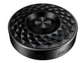 Compact black, orange, and silvery white portable Bluetooth speaker on a table