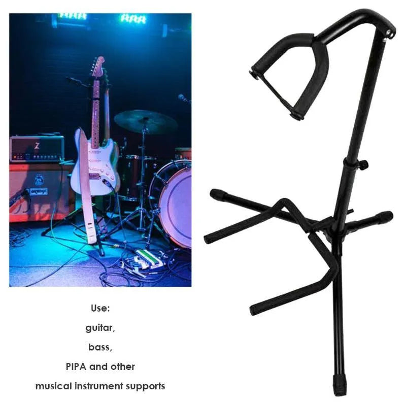 Black foldable metal guitar stand with rubber pads, holding an acoustic guitar.