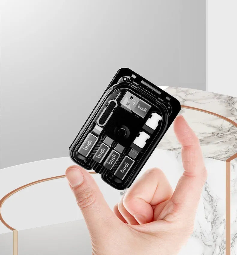 Black digital urban survival card with a short attached cable, conversion head, and slots for TF and nano SIM cards.