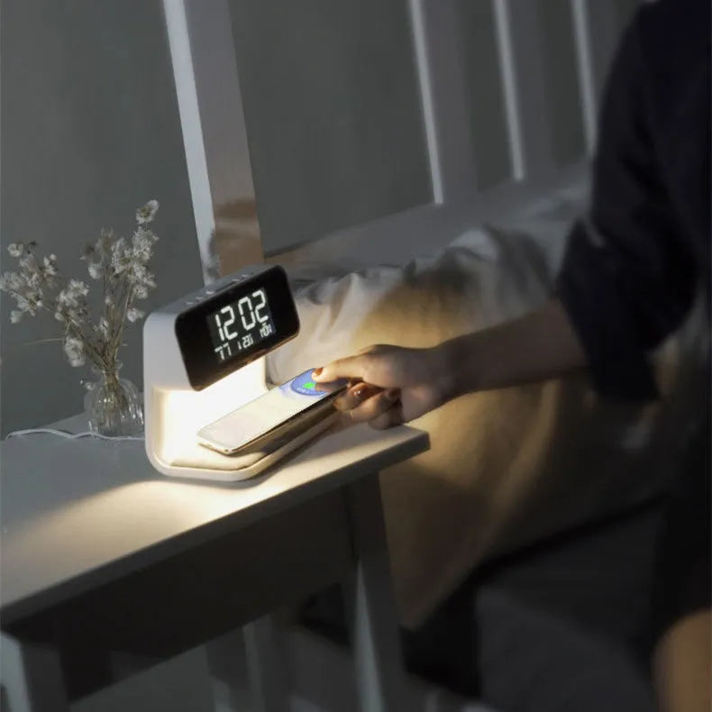 White 3-in-1 bedside lamp with wireless charging pad, LCD clock screen, and fabric-effect ABS shade.