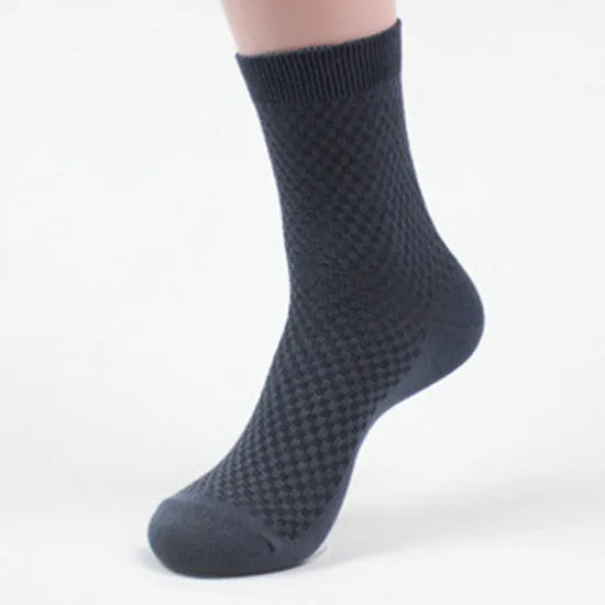 A pair of men's bamboo fibre socks in a classic colour, showing the small square pattern and medium thickness.