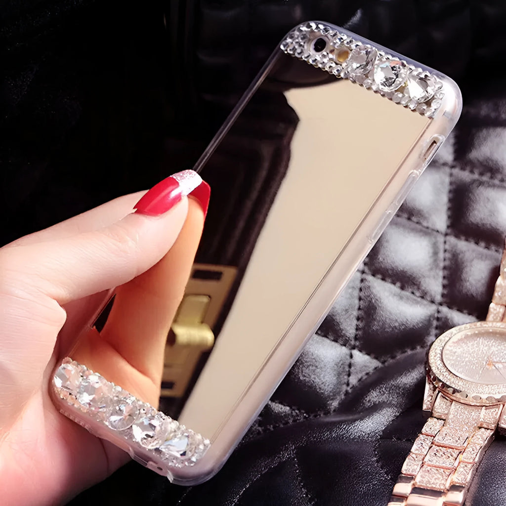 Gold rhinestone decorative silicone back cover case for a Huawei smartphone on a table.