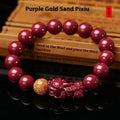 Purple gold sandstone cinnabar bracelet with totem elements on a wrist.